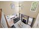 Open-concept living space with fireplace, high ceilings, and view of dining area and kitchen at 1440 Teaberry Path, Charleston, SC 29414