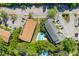 Aerial view showcasing a community with a pool, parking, landscaping, and charming rooflines at 1530 Fort Johnson Rd # 3C, Charleston, SC 29412