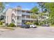 Attractive apartment complex with multiple levels and white balconies and stairs in a nice landscaped community at 1530 Fort Johnson Rd # 3C, Charleston, SC 29412