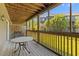 Enclosed patio providing an outdoor dining area with natural light and views of the nearby greenery at 1530 Fort Johnson Rd # 3C, Charleston, SC 29412