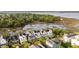 Drone shot exhibits luxury waterfront homes with lush greenery and stunning marsh views at 158 Mary Ellen Dr, Charleston, SC 29403