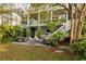 Backyard features a patio, outdoor bar area, green lawn, and access to the main house at 158 Mary Ellen Dr, Charleston, SC 29403