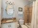 Cozy bathroom with granite counters and a shower-tub combo, designed for comfort at 158 Mary Ellen Dr, Charleston, SC 29403