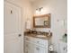 Well-lit bathroom featuring granite counters, a decorative mirror, and ample storage at 158 Mary Ellen Dr, Charleston, SC 29403