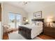 Spacious bedroom features dark wood furniture and a French door balcony at 158 Mary Ellen Dr, Charleston, SC 29403