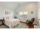 Serene bedroom features a comfortable bed, a rocking chair, and plenty of natural light at 158 Mary Ellen Dr, Charleston, SC 29403