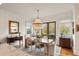 Bright dining room with elegant lighting fixture and stylish furniture at 158 Mary Ellen Dr, Charleston, SC 29403