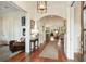 Elegant hallway with wood floors and arched doorways, leading to the living areas at 158 Mary Ellen Dr, Charleston, SC 29403