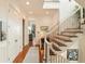 Bright hallway featuring hardwood floors, a staircase, and elegant white trim at 158 Mary Ellen Dr, Charleston, SC 29403