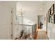Bright hallway featuring hardwood floors, a staircase, and elegant white trim at 158 Mary Ellen Dr, Charleston, SC 29403