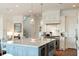 Modern kitchen with a large island, wine fridge, and stainless steel appliances at 158 Mary Ellen Dr, Charleston, SC 29403