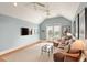 Bright living room with vaulted ceilings, comfortable seating, and a balcony access at 158 Mary Ellen Dr, Charleston, SC 29403