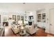 Bright living room features hardwood floors, fireplace, and custom built-in shelving at 158 Mary Ellen Dr, Charleston, SC 29403