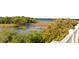 Expansive marsh view from balcony showcasing tranquil waters and diverse foliage at 158 Mary Ellen Dr, Charleston, SC 29403