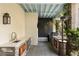 Covered outdoor kitchen featuring modern appliances, stone countertops, and a cozy ambiance at 158 Mary Ellen Dr, Charleston, SC 29403