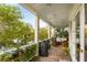 Charming porch with outdoor seating, views of lush landscape, and a peek at the water at 158 Mary Ellen Dr, Charleston, SC 29403