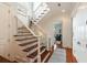 Elegant staircase with wood treads, iron spindles, and plenty of natural light at 158 Mary Ellen Dr, Charleston, SC 29403