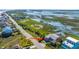 Aerial view of home with multiple decks next to the marsh and beach at 1604 E Ashley Ave, Folly Beach, SC 29439