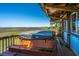 Hot tub on a deck overlooking a beautiful marsh and the ocean beyond at 1604 E Ashley Ave, Folly Beach, SC 29439