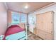 Bedroom with a single bed, desk, and bureau. Features a window with a nice view at 1604 E Ashley Ave, Folly Beach, SC 29439