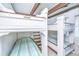 Charming bunk room featuring built-in bunk beds with striped linens and storage at 1604 E Ashley Ave, Folly Beach, SC 29439