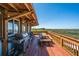Outdoor deck with a grill, wood table, and views of the marsh at 1604 E Ashley Ave, Folly Beach, SC 29439