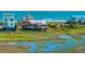 Charming coastal home offering breathtaking views of the marsh and nearby ocean at 1604 E Ashley Ave, Folly Beach, SC 29439