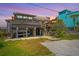 Charming coastal home with elevated construction, offering a unique design and marsh view at sunset at 1604 E Ashley Ave, Folly Beach, SC 29439
