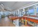 Open living space with floor-to-ceiling windows, views of the water, and comfortable furnishings at 1604 E Ashley Ave, Folly Beach, SC 29439