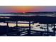 Sunset view from a private pier overlooking the tranquil water at 1604 E Ashley Ave, Folly Beach, SC 29439