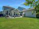 Expansive backyard with a well-manicured lawn and a cozy patio perfect for outdoor entertaining at 1673 Emmets Rd, Johns Island, SC 29455