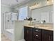 Bathroom features a double vanity, a large mirror, and a separate tub and shower at 1673 Emmets Rd, Johns Island, SC 29455