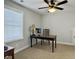 Bedroom with neutral carpet featuring a large desk, ceiling fan, and natural light from the window at 1673 Emmets Rd, Johns Island, SC 29455
