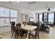 Open dining area with a long table, chairs, and easy access to the living area at 1673 Emmets Rd, Johns Island, SC 29455