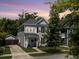 Charming two-story home featuring gray siding, black shutters, and a welcoming front yard at 1673 Emmets Rd, Johns Island, SC 29455