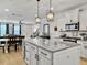 Open concept kitchen with an island, pendant lighting, and view of the adjacent dining area at 1673 Emmets Rd, Johns Island, SC 29455