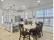 Modern kitchen with white cabinets, stainless appliances, and a functional island at 1673 Emmets Rd, Johns Island, SC 29455