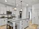 Bright kitchen with white cabinets, granite countertops, stainless steel appliances, and an island at 1673 Emmets Rd, Johns Island, SC 29455