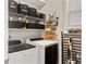 Functional laundry room with built-in shelving, washer, and dryer at 1673 Emmets Rd, Johns Island, SC 29455