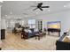 Bright and spacious living room featuring an open floor plan, with views of the kitchen and dining area at 1673 Emmets Rd, Johns Island, SC 29455