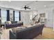 Inviting living room featuring comfortable seating, bright windows, and modern decor at 1673 Emmets Rd, Johns Island, SC 29455