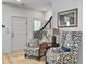 Living room displaying stylish wingback chairs, accent table, and decorative art pieces at 1673 Emmets Rd, Johns Island, SC 29455