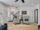 Bright living room with cozy armchairs and neutral decor creating a welcoming space at 1673 Emmets Rd, Johns Island, SC 29455