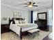 Main bedroom features a plush bed, ceiling fan, and dresser at 1673 Emmets Rd, Johns Island, SC 29455