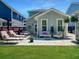 Inviting outdoor patio with lounge chairs, dining table, and decorative accents for relaxation and socializing at 1673 Emmets Rd, Johns Island, SC 29455