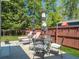 Comfortable outdoor setting with umbrellas, chairs and tables for outdoor entertaining and relaxing at 1673 Emmets Rd, Johns Island, SC 29455