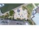 Overhead view of a charming outdoor venue with umbrella-shaded tables, fountain, and lush landscaping near the docks at 1880 Andell Bluff Blvd # Slip E 9, Johns Island, SC 29455