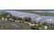 An aerial photograph captures waterfront condos and the marina with boats docked along the harbor at 1880 Andell Bluff Blvd # Slip E 9, Johns Island, SC 29455