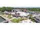 Aerial view of waterfront venue with a prominent flagpole, outdoor dining areas, and ample parking surrounded by lush greenery at 1880 Andell Bluff Blvd # Slip E 9, Johns Island, SC 29455