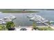 Picturesque marina featuring numerous boats docked along piers, with a view of waterfront amenities and a prominent flagpole at 1880 Andell Bluff Blvd # Slip E 9, Johns Island, SC 29455